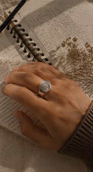 Signet ring worn while reading