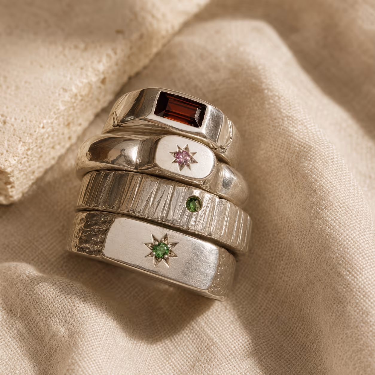 Four silver rings stacked