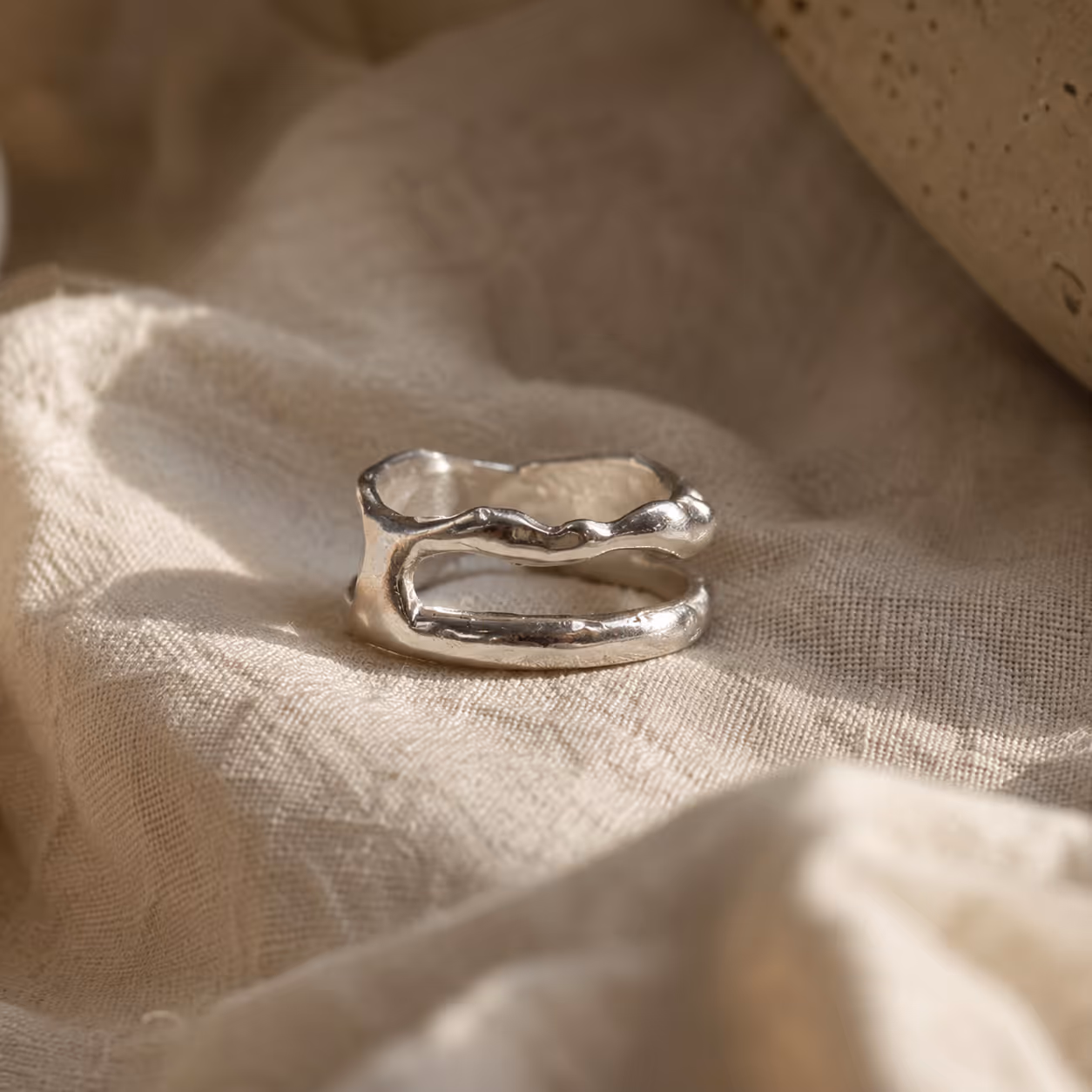 Single silver ring on cloth