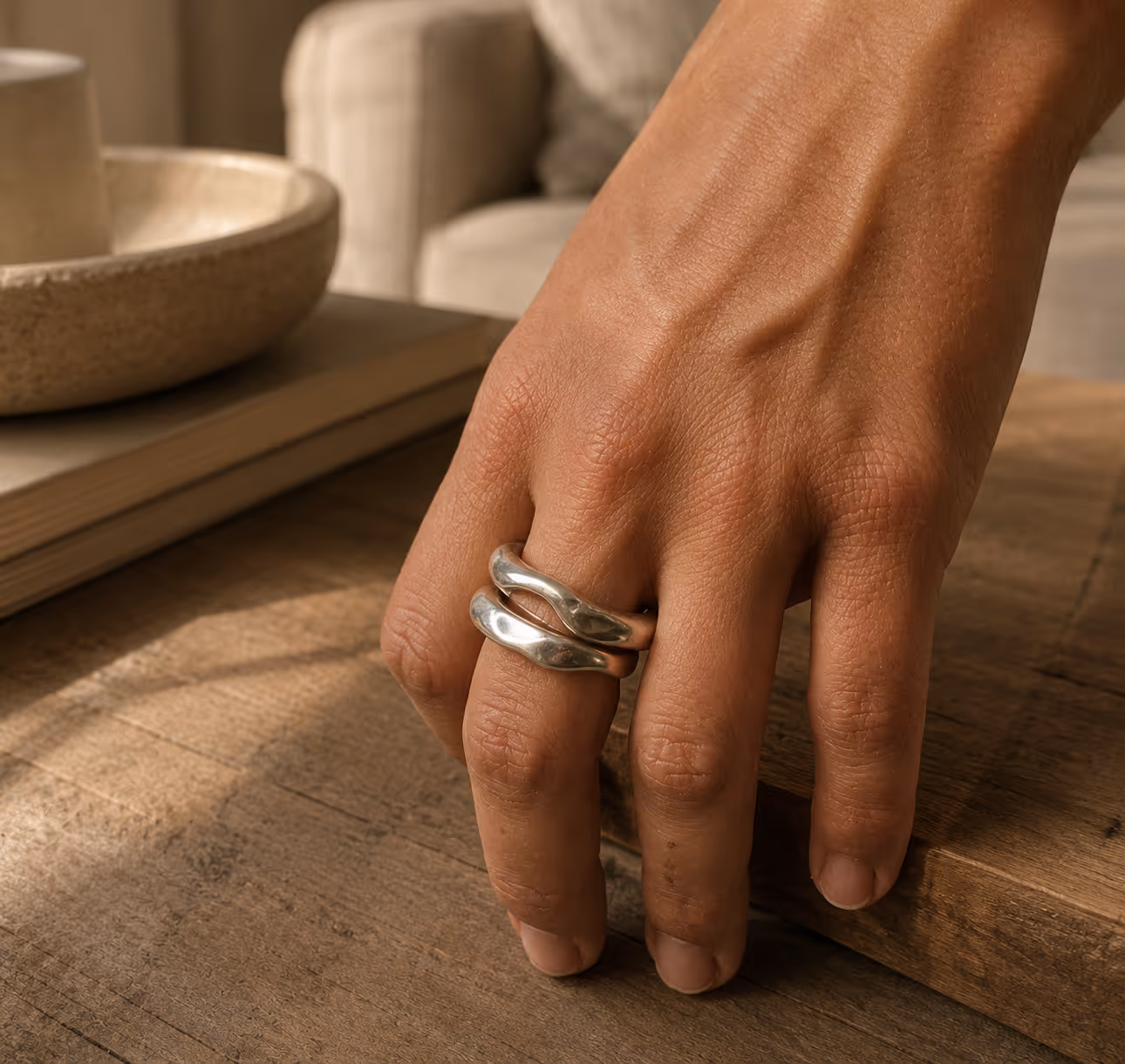 Person typing with ring visible