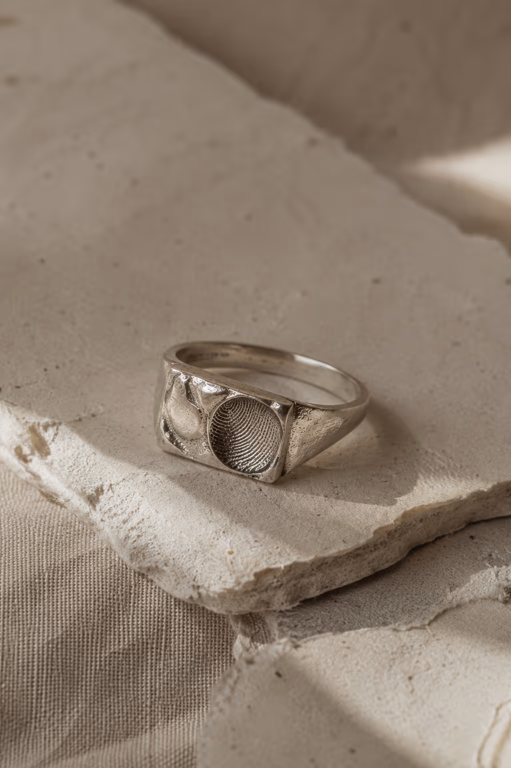 Single silver signet on stone